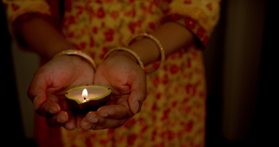 Close-up of Woman Holding Lit Diya During Festival Celebration