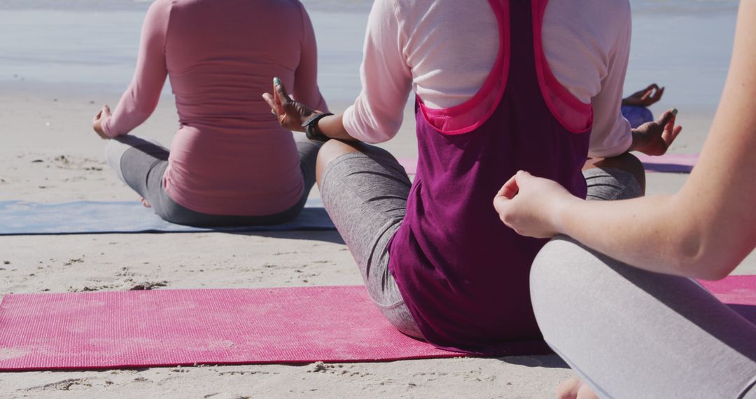 Group of Women Meditating on Beach - Free Images, Stock Photos and Pictures on Pikwizard.com