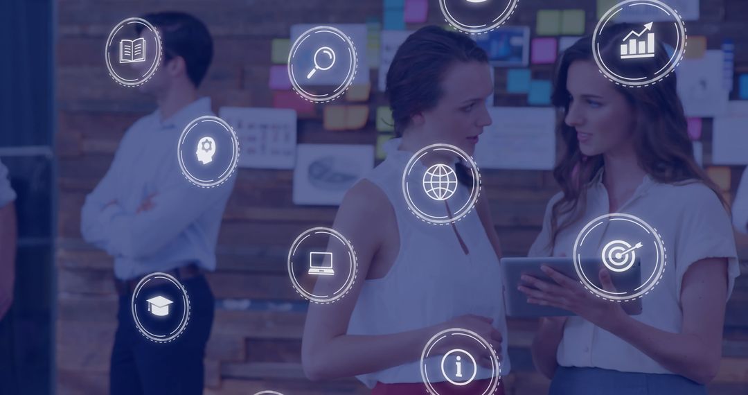 Digital Innovation in Modern Office: Businesswomen Collaborating with Tablet