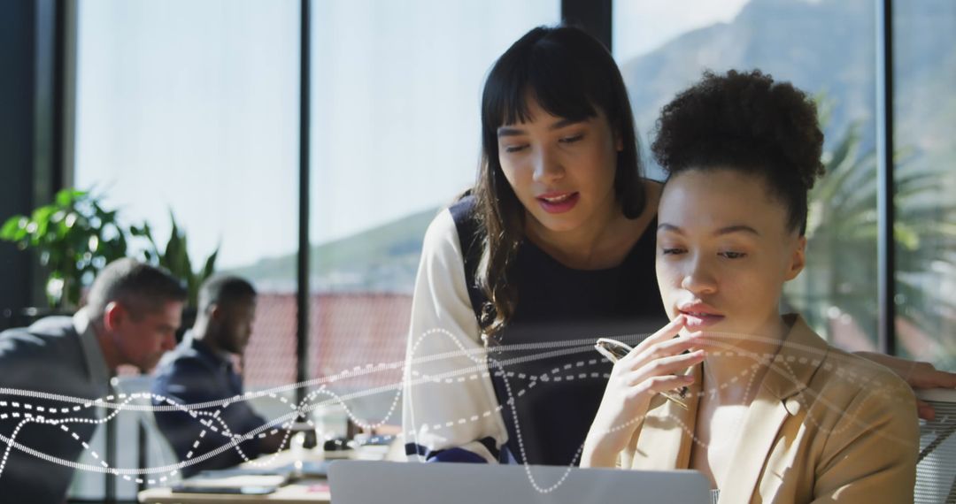 Business Women Collaborating on Innovative Project