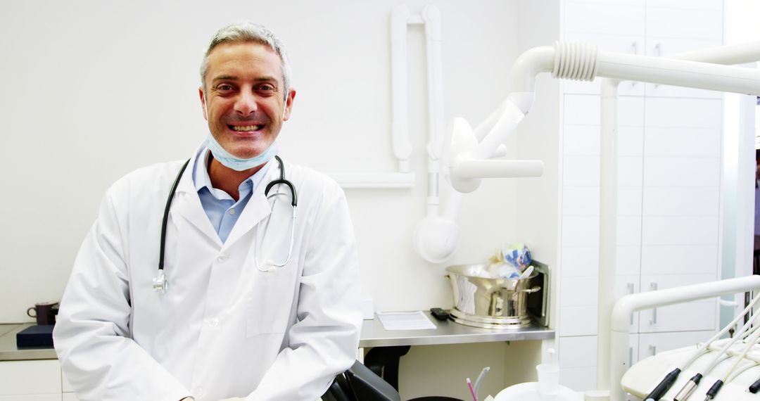 Portrait of smiling dentist standing in dental clinic 4k - Free Images, Stock Photos and Pictures on Pikwizard.com