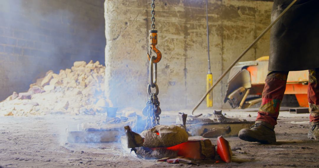 Industrial Worker Handling Red-Hot Metal Casting with Crane - Free Images, Stock Photos and Pictures on Pikwizard.com