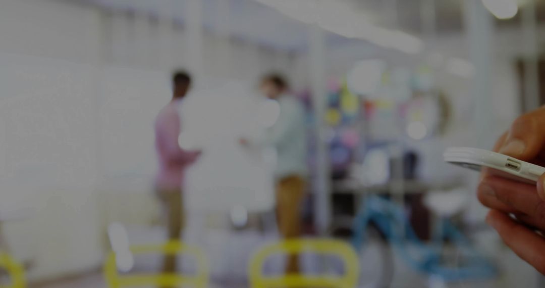 Using Smartphone in Modern Office Environment with Colleagues