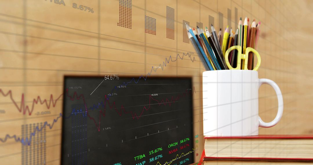 White Mug Holding Pencils and Scissors on Red Books with Overlayed Stock Charts
