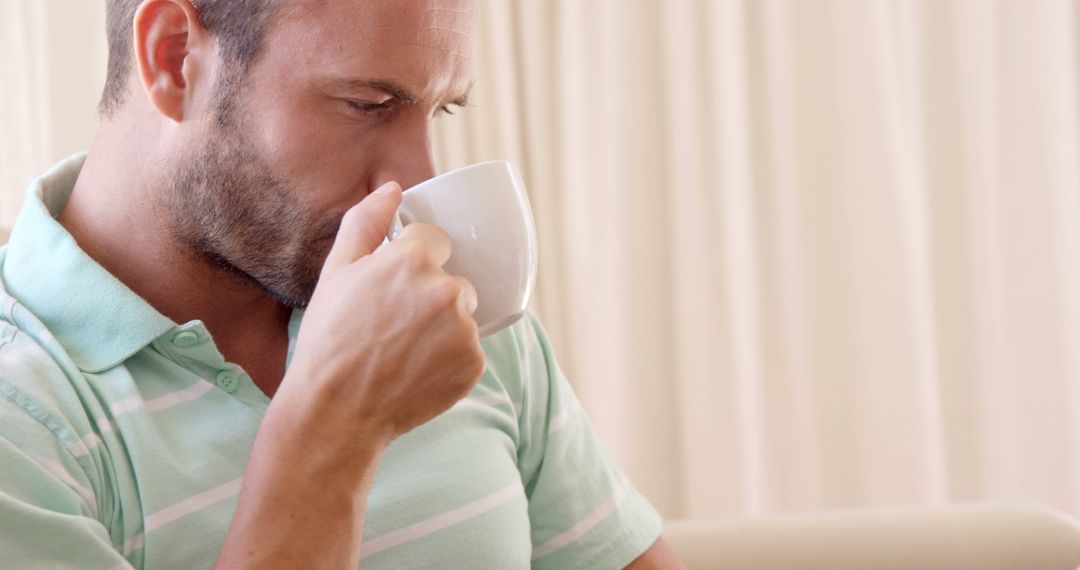 Man savoring morning coffee in serene environment - Free Images, Stock Photos and Pictures on Pikwizard.com