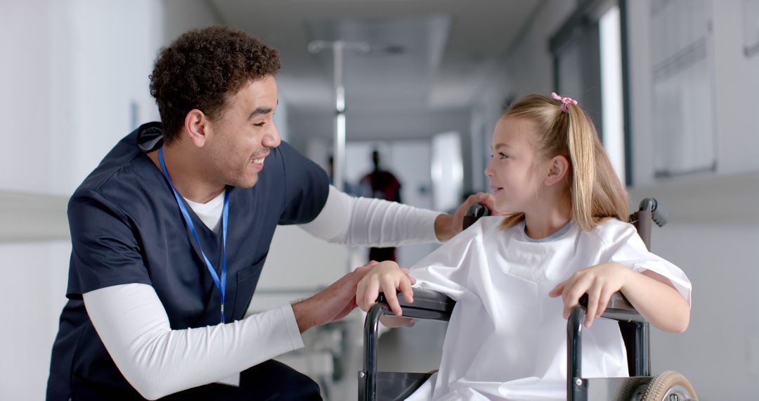 Friendly Nurse Assisting Young Patient in Wheelchair - Free Images, Stock Photos and Pictures on Pikwizard.com