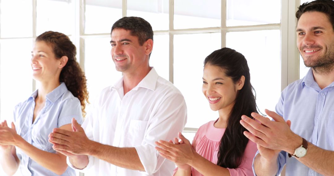 Diverse Team Applauding in Modern Office Environment