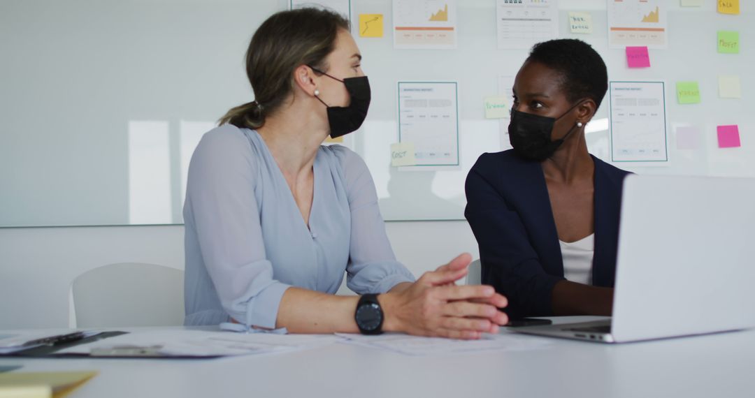 Diverse Colleagues Collaborating Safely During Pandemic