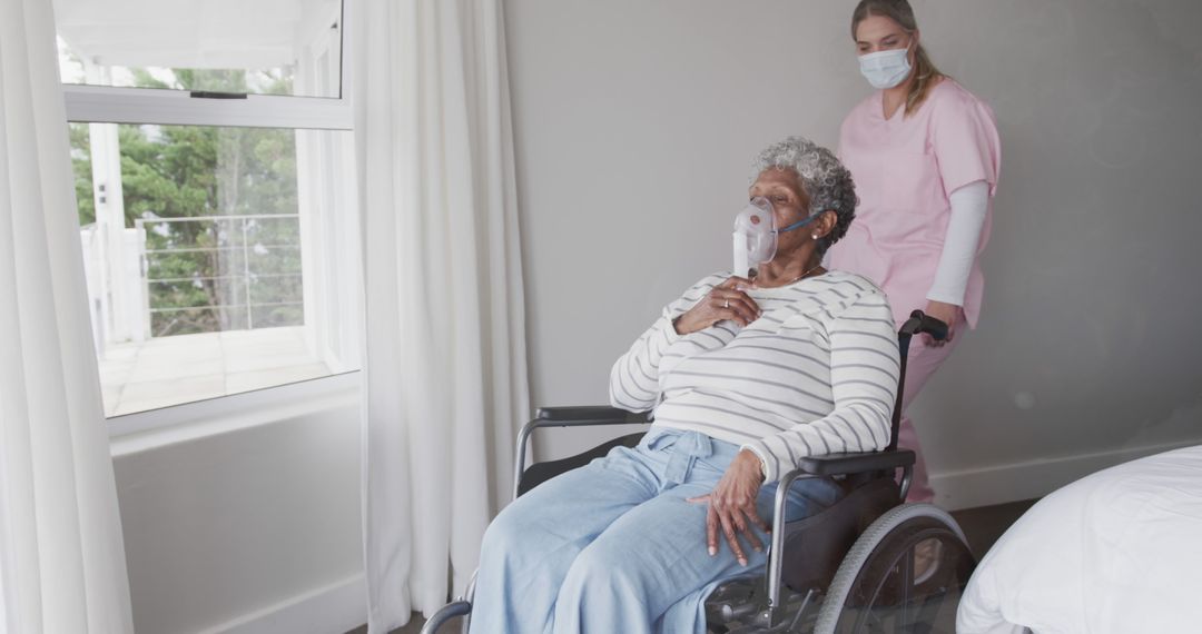 Caregiver Assisting Senior Woman in Wheelchair with Oxygen Mask - Free Images, Stock Photos and Pictures on Pikwizard.com