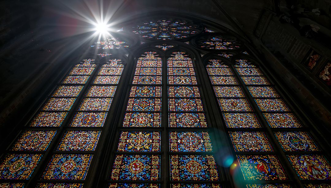 Sunburst Illuminates Stained Glass in Historical Church