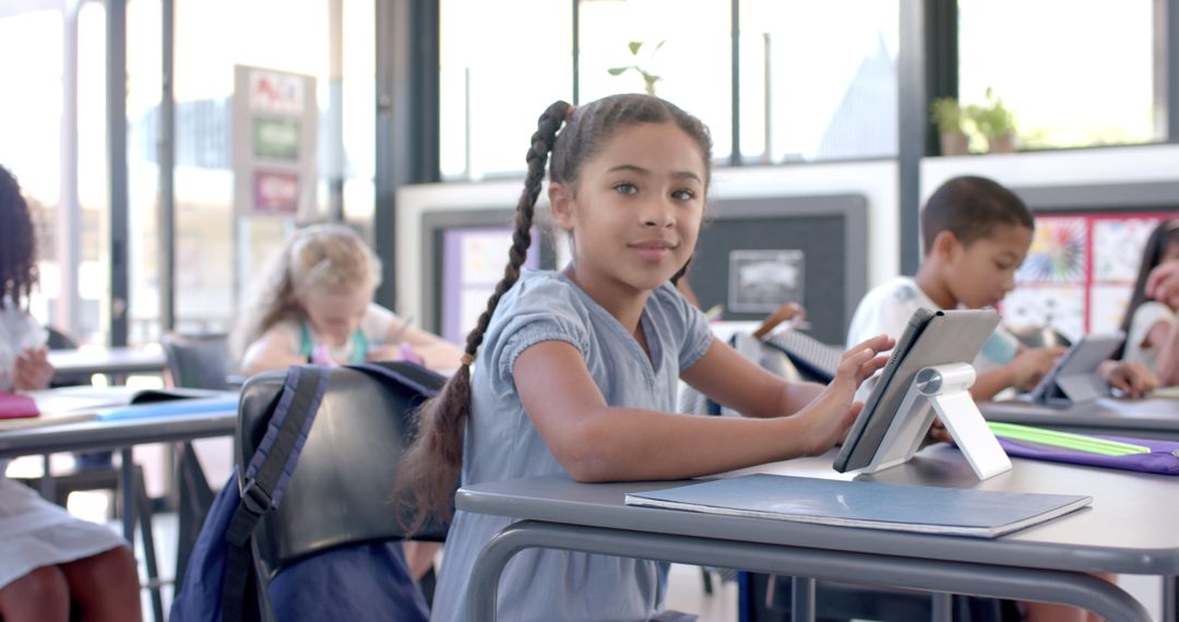 Engaged School Students Using Tablets in Modern Classroom