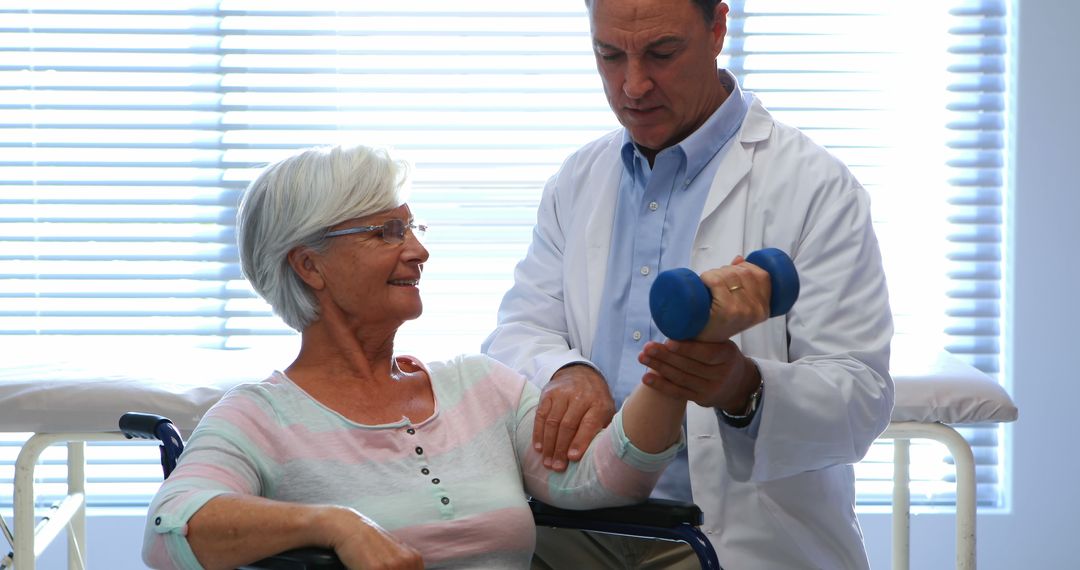 Senior Woman Undergoing Physical Therapy with Therapist - Free Images, Stock Photos and Pictures on Pikwizard.com