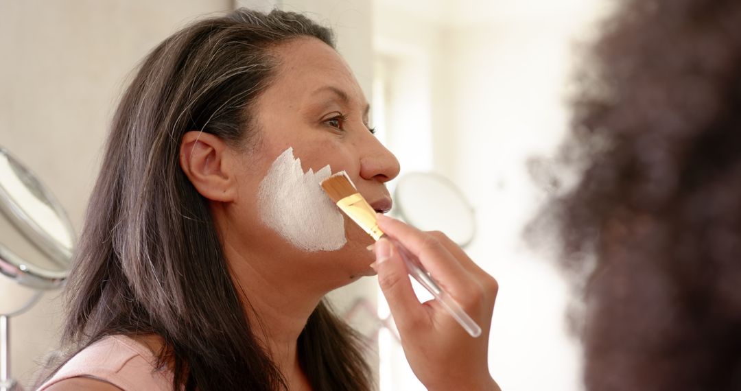 Woman Enjoying Facial Treatment with Face Mask at Home