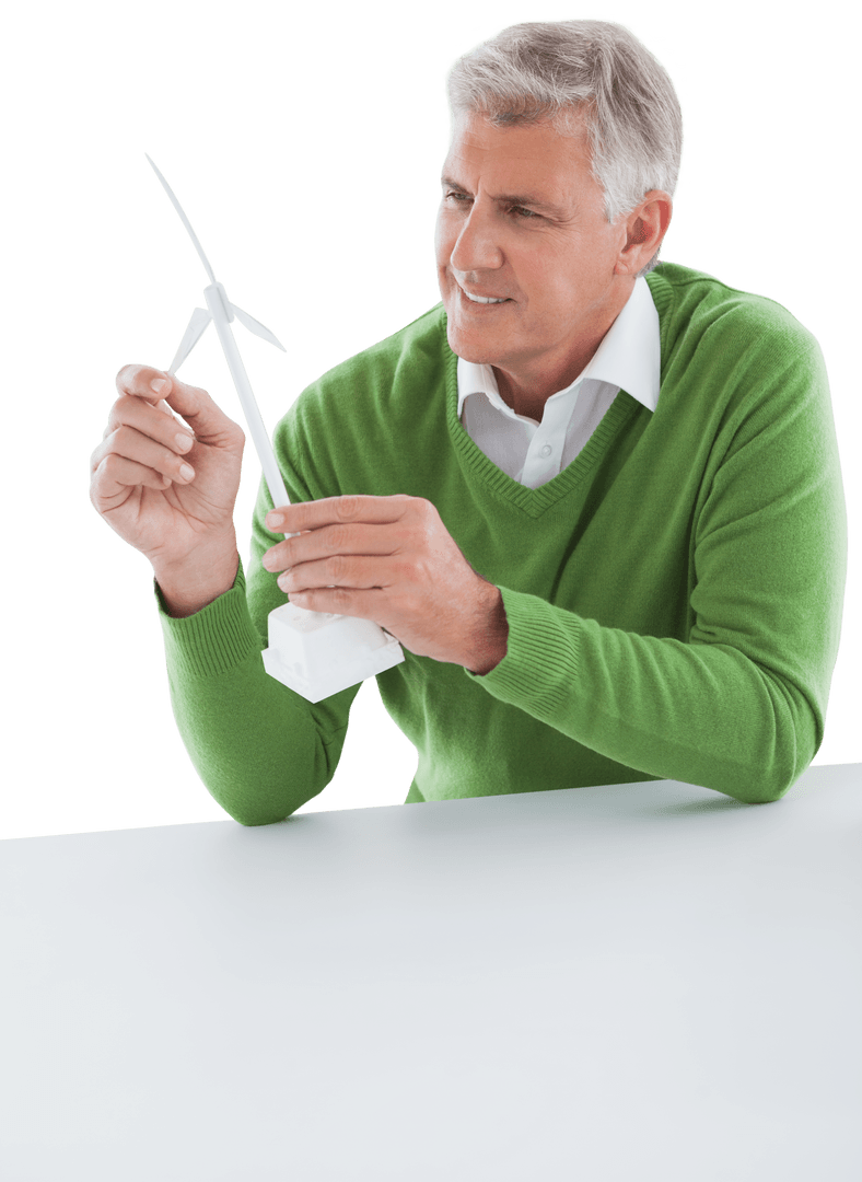 Senior Man Examining Transparent Wind Turbine Model