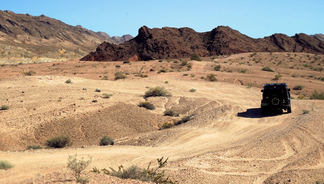Off-Road Vehicle Traversing Remote Desert Landscape