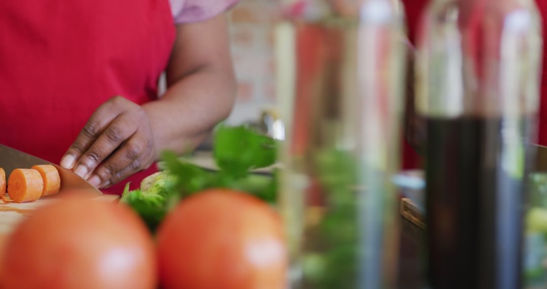 Close-up of person chopping vegetables in kitchen - Free Images, Stock Photos and Pictures on Pikwizard.com