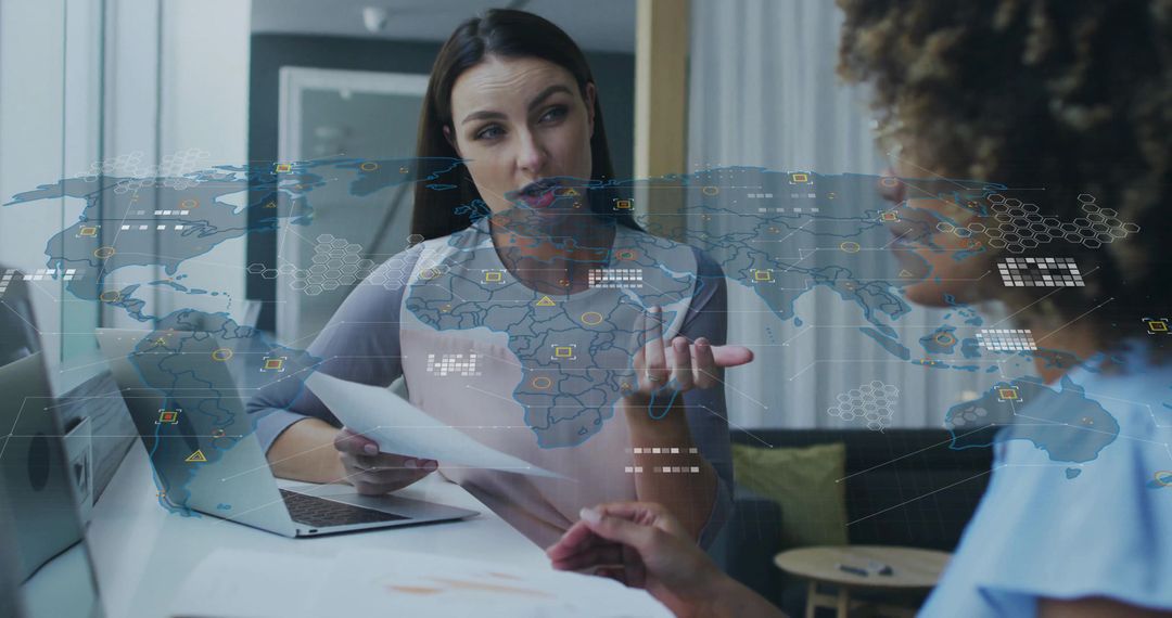 Professional Women Collaborating with Futuristic Holographic World Map