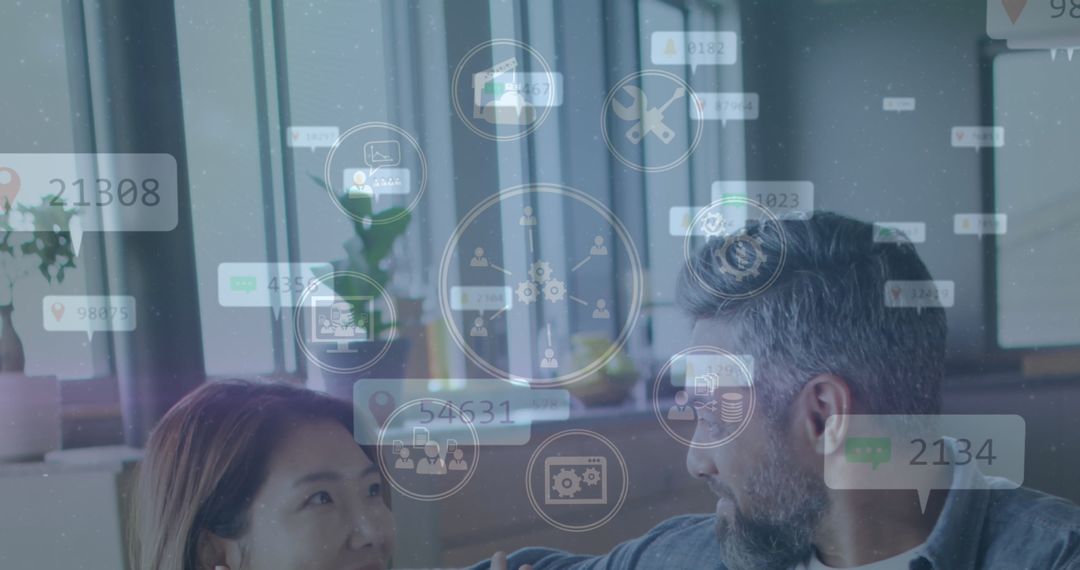 Casually Dressed Colleagues Collaborating in Modern Office with Tech Icons