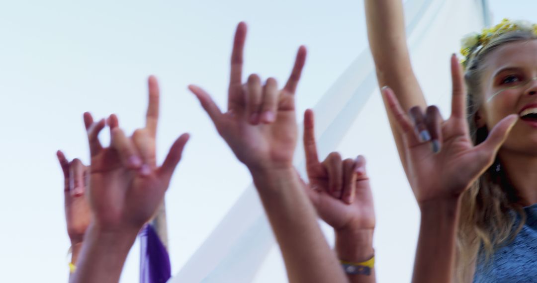 Group of People Showing Hand Sign for Love at Music Festival - Free Images, Stock Photos and Pictures on Pikwizard.com