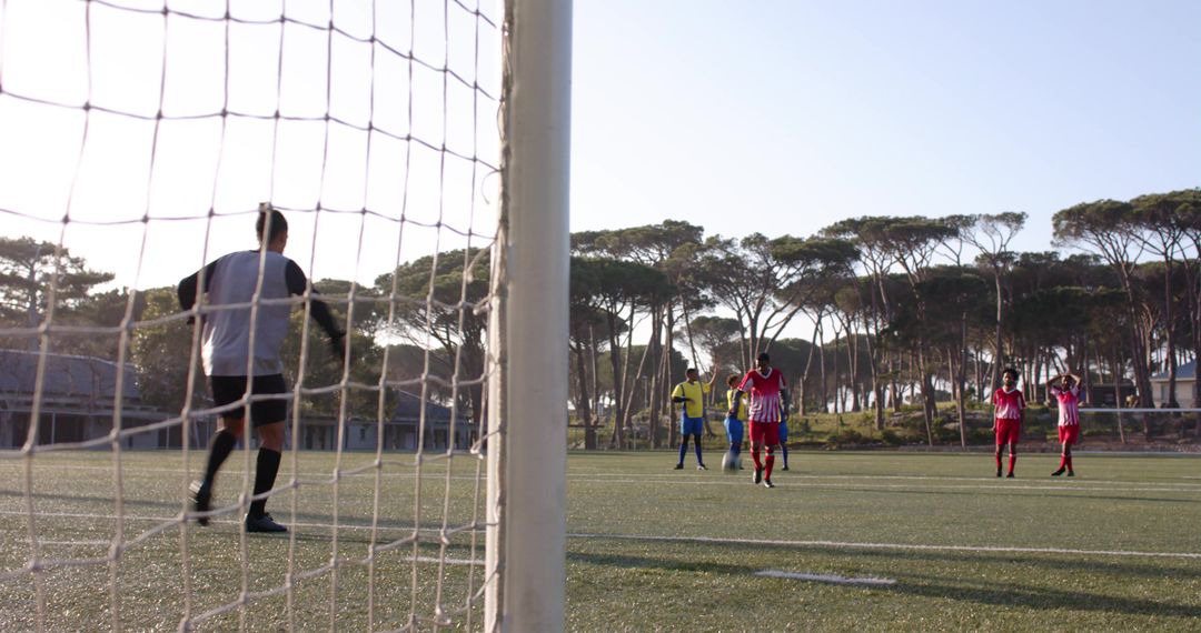 Youth Soccer Players Practicing Teamwork on Sunny Day