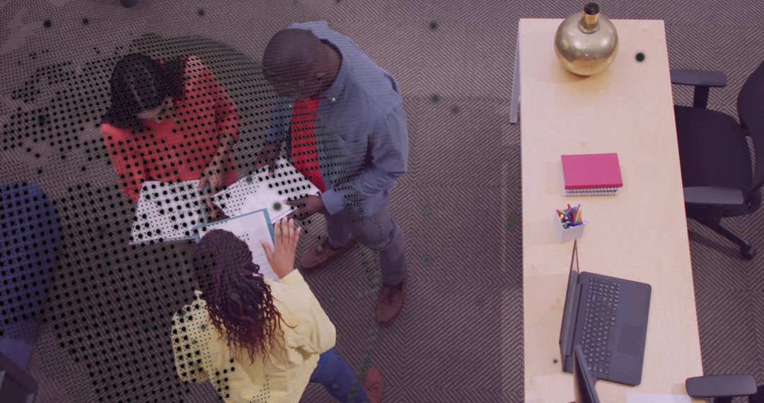 Coworkers Collaborating Over Documents and Tablet