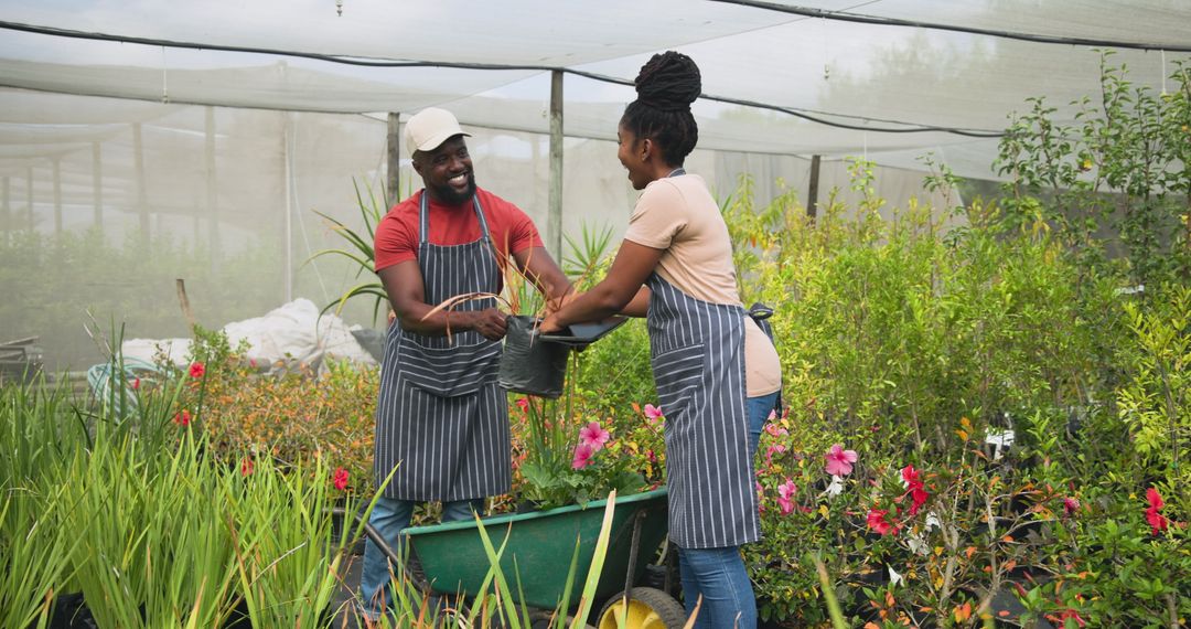 Nursery Workers Collaborating in Garden Center Setting