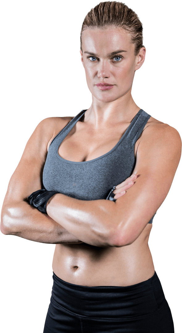 Muscular Woman with Crossed Arms Demonstrating Determination