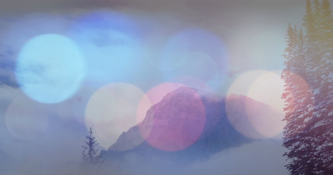 Magical Bokeh Lights Over Snowy Mountain Landscape