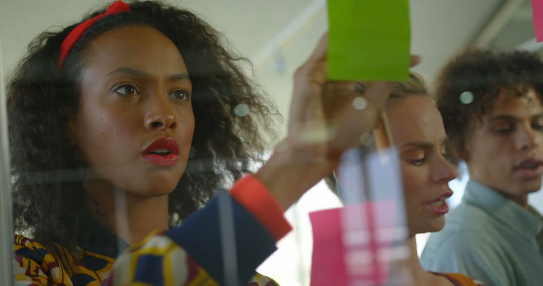 Creative Team Works on Sticky Notes in Modern Office