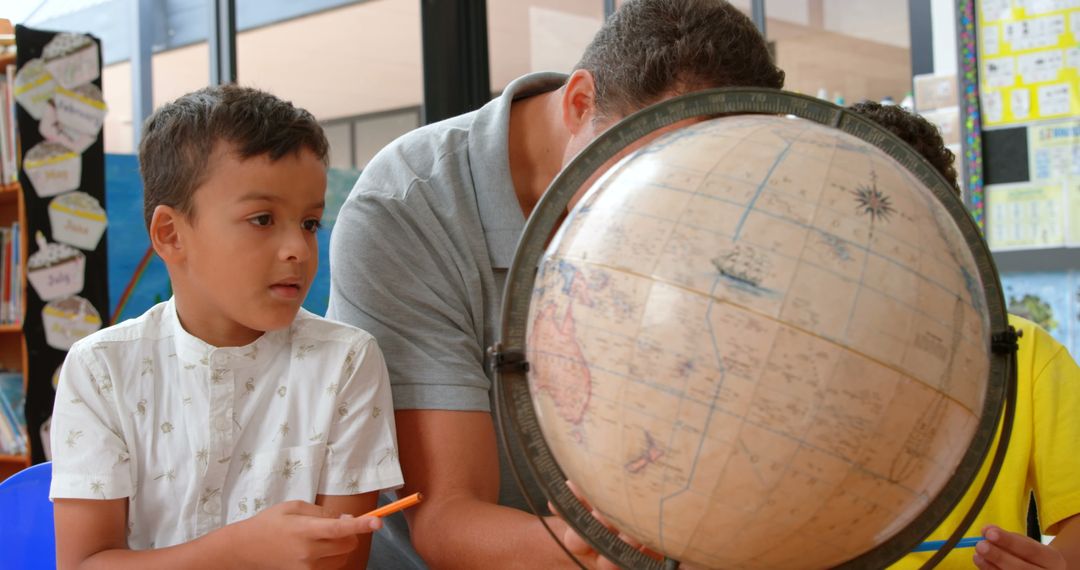 Teacher Explaining Geography Concepts Using Globe in Classroom