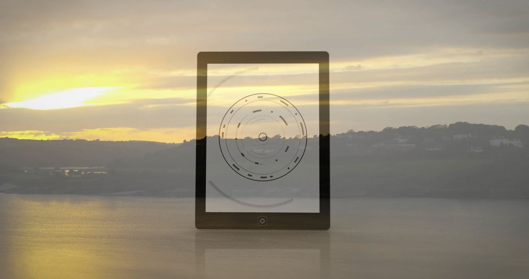 Futuristic tablet with circular radar display by lakeside