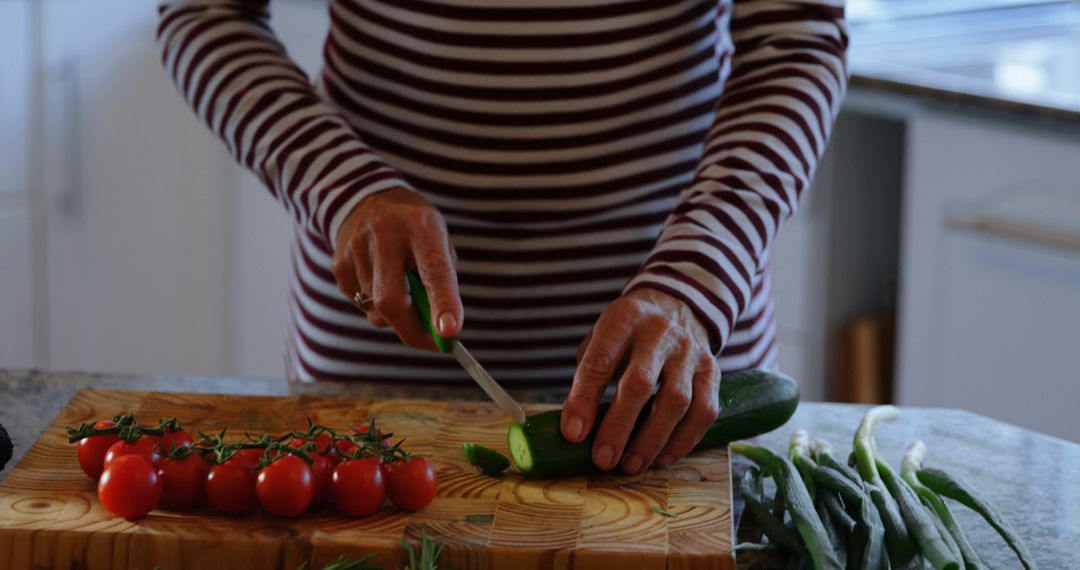 Person Slicing Vegetables in Modern Kitchen - Free Images, Stock Photos and Pictures on Pikwizard.com