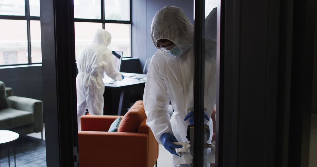 Cleaning Staff Disinfecting Office Wearing Protective Suits - Free Images, Stock Photos and Pictures on Pikwizard.com