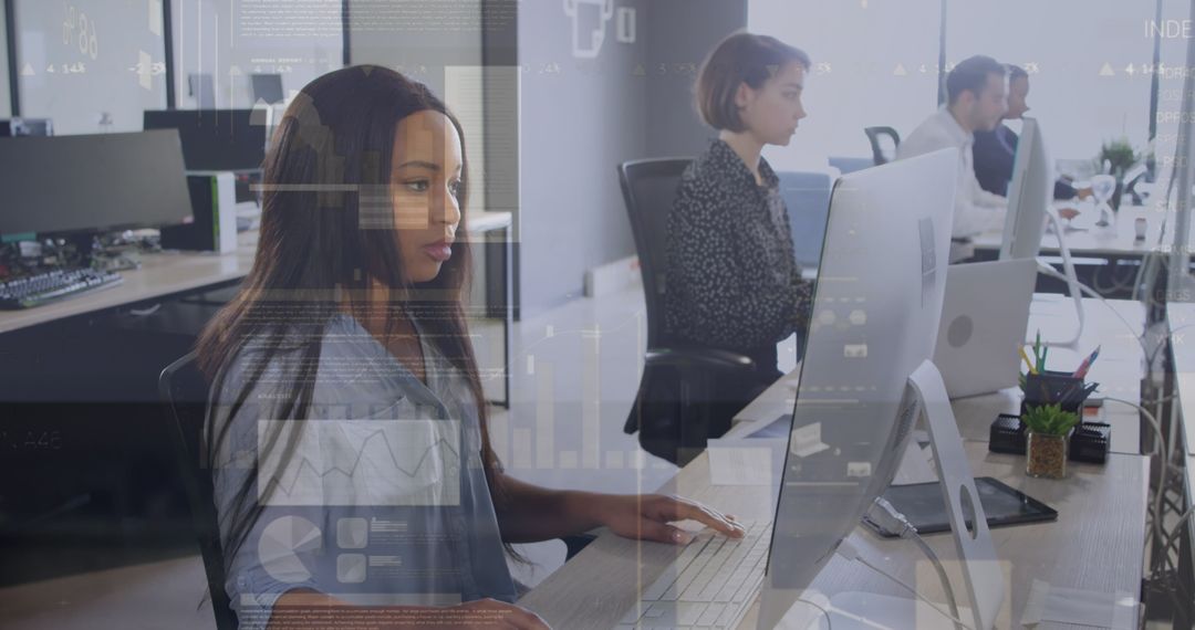 Corporate Professionals Focusing on Digital Work in Modern Office