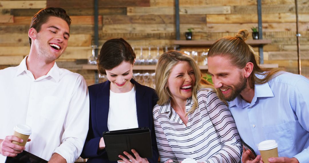 Friends Enjoying Coffee and Technology at Trendy Cafe