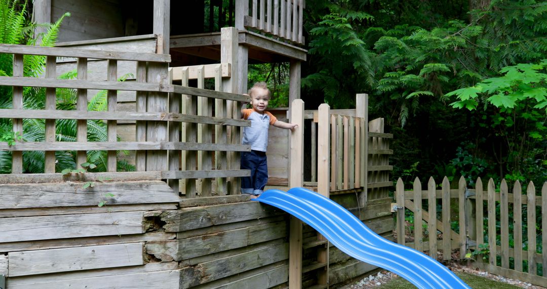 Young Child Playing on Backyard Wooden Playground with Slide - Free Images, Stock Photos and Pictures on Pikwizard.com