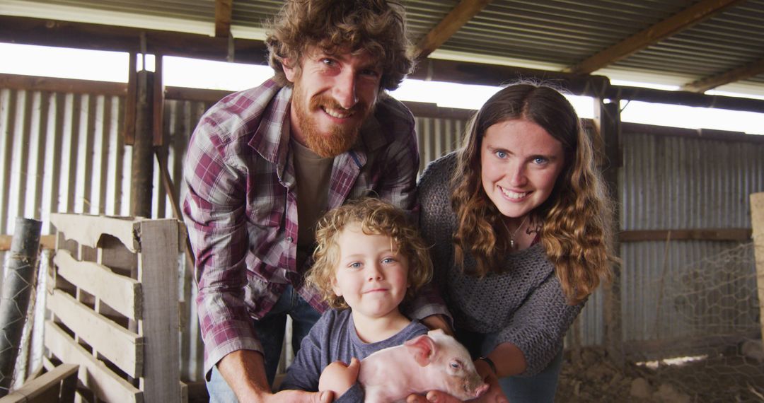 Happy Family with Toddler Holding Piglet in Barn - Free Images, Stock Photos and Pictures on Pikwizard.com