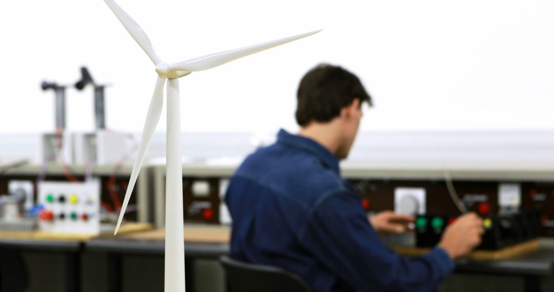 Engineer Testing Wind Turbine Model in Modern Laboratory Setting - Free Images, Stock Photos and Pictures on Pikwizard.com