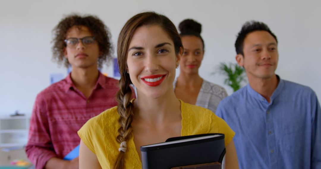 Diverse Team Standing Confidently in Modern Office Atmosphere