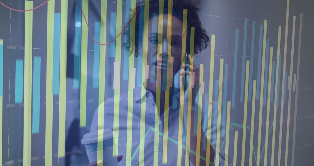 Businesswoman Analyzing Data While on Phone in Office Environment