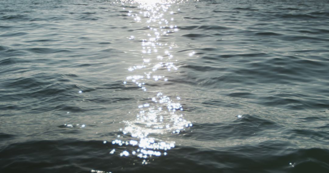 Sunlight reflected on rippled pattern of calm blue ocean - Free Images, Stock Photos and Pictures on Pikwizard.com