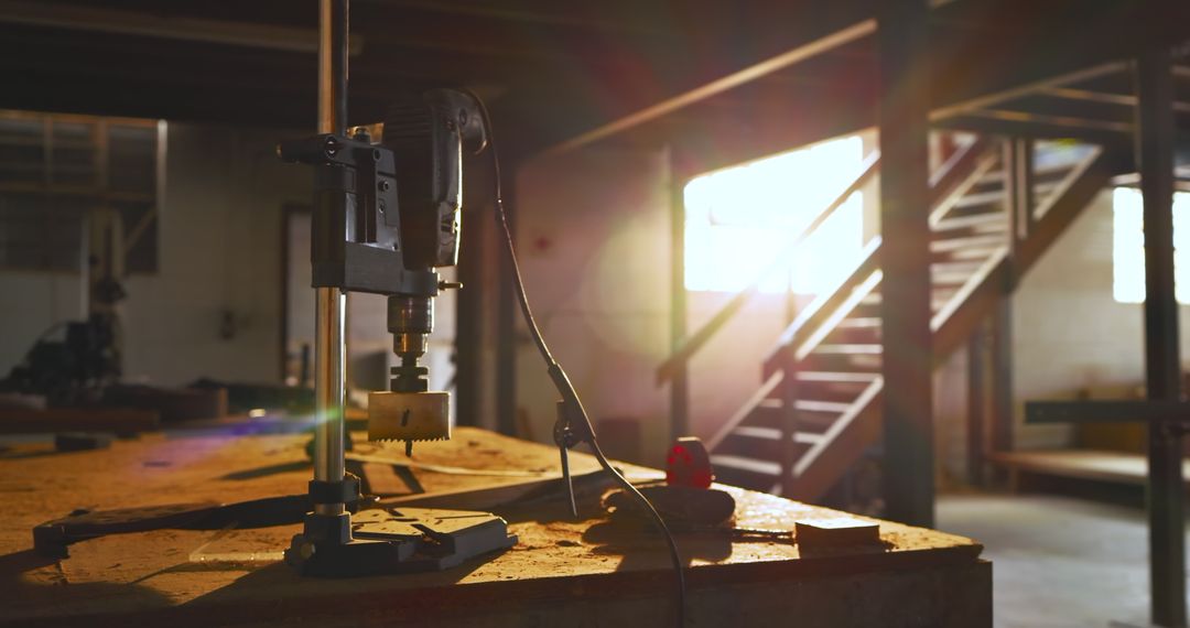 Sunlit Workshop with Drill Press on Workbench