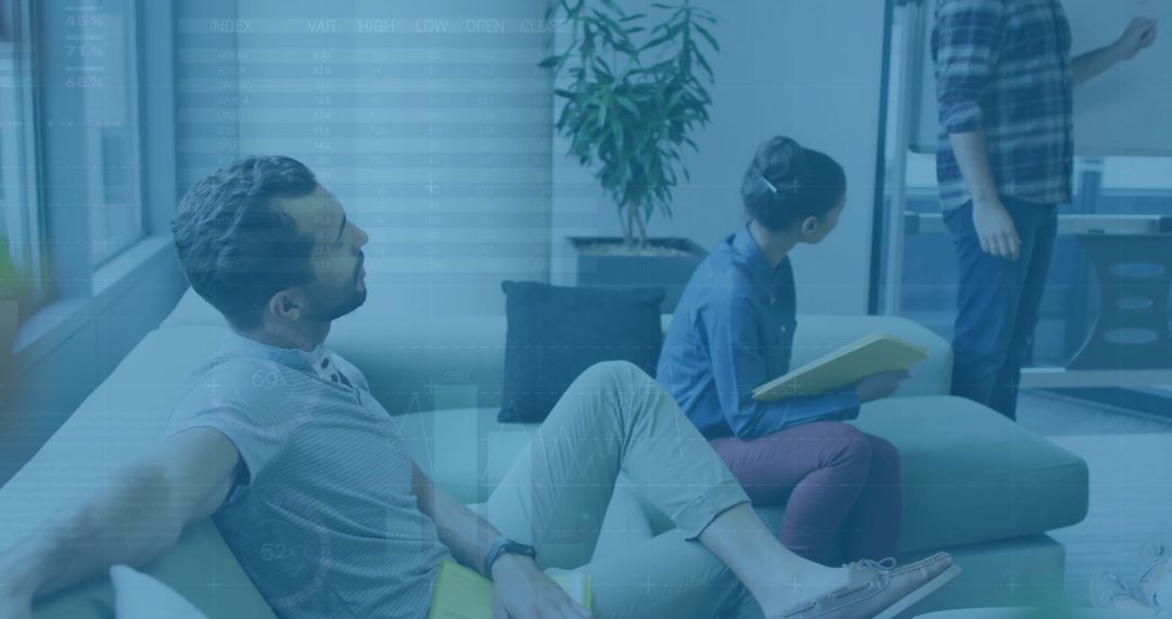 Business Team Analyzing Data With Financial Graphic Overlay