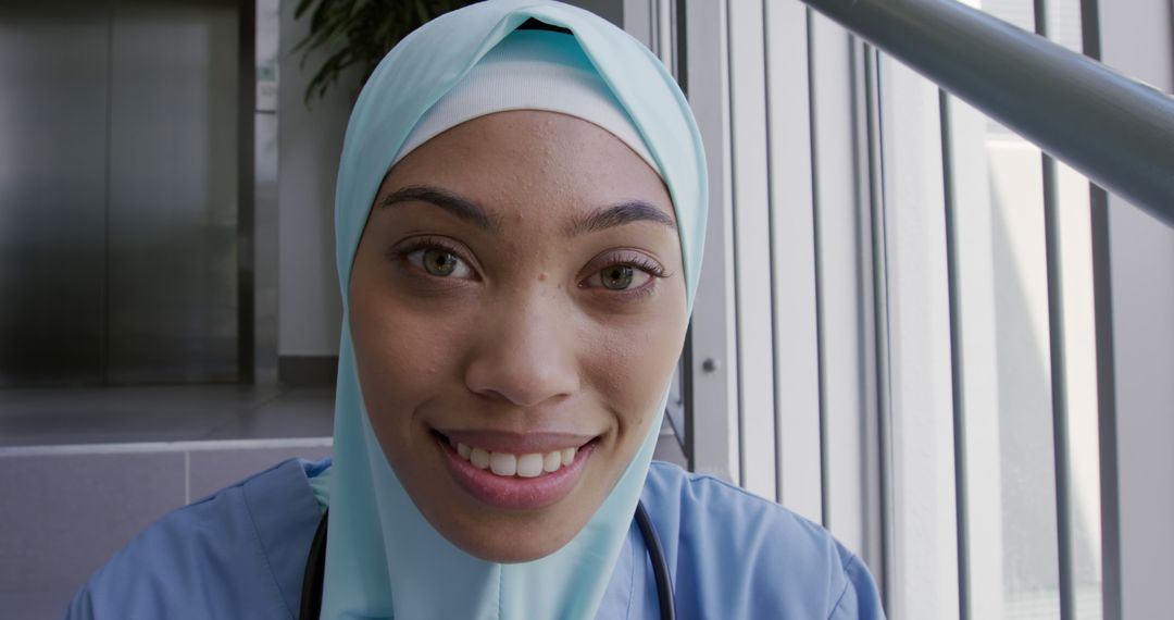 Smiling Young Female Nursing Professional in Hijab at Hospital - Free Images, Stock Photos and Pictures on Pikwizard.com