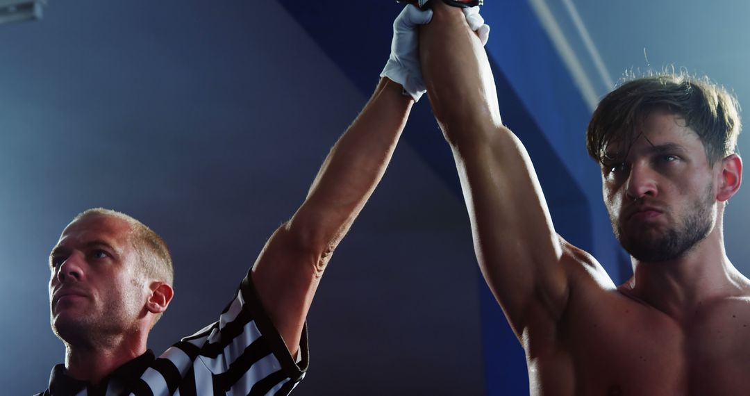 Male Boxer Celebrates Victory with Referee in Boxing Ring - Free Images, Stock Photos and Pictures on Pikwizard.com