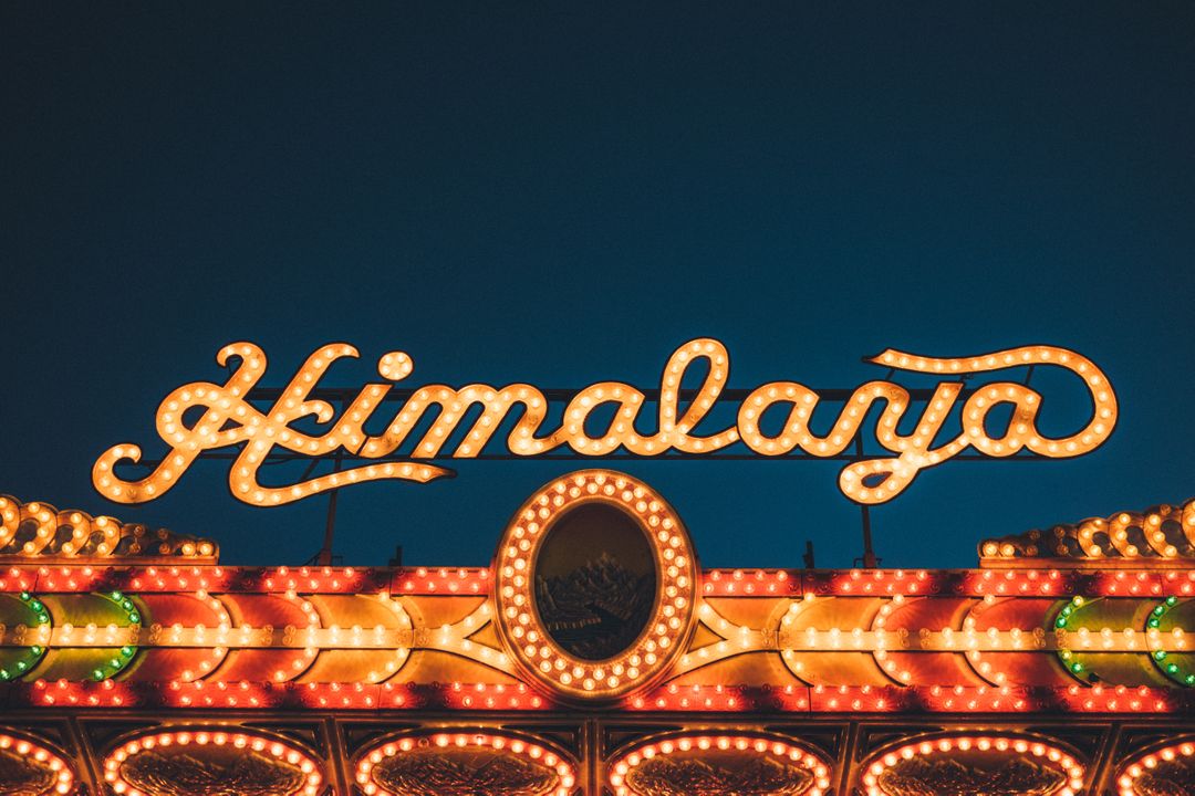 Retro Illuminated Fairground Sign at Night - Free Images, Stock Photos and Pictures on Pikwizard.com