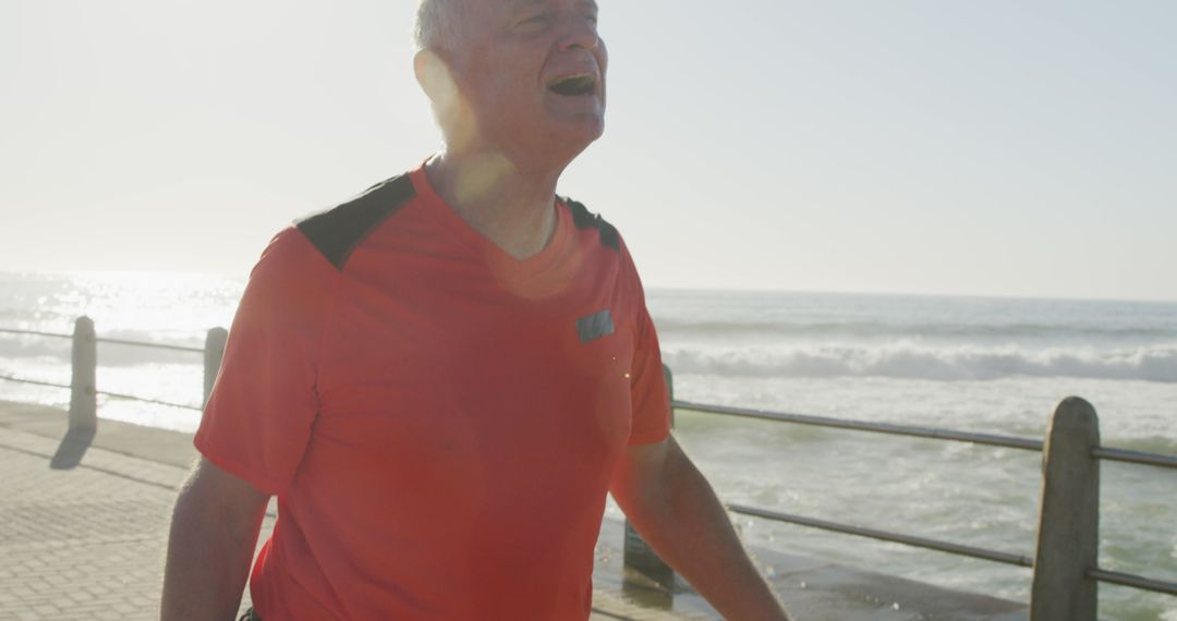 Senior Man Enjoying Morning Run by Ocean - Free Images, Stock Photos and Pictures on Pikwizard.com