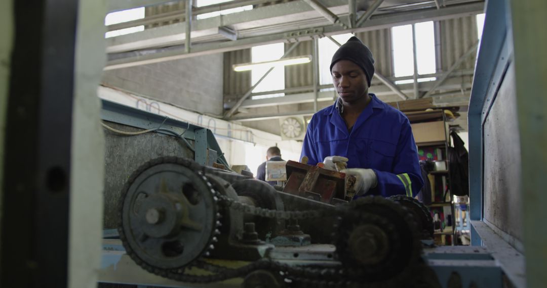 African American Industrial Worker Operating Heavy Machinery in Factory - Free Images, Stock Photos and Pictures on Pikwizard.com