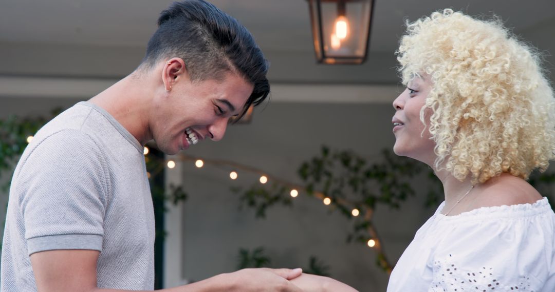 Man Proposing with Engagement Ring to Excited Woman at Home