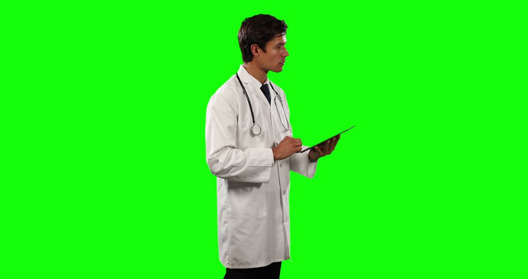 Male Doctor Holding Clipboard with Stethoscope on Green Screen - Free Images, Stock Photos and Pictures on Pikwizard.com